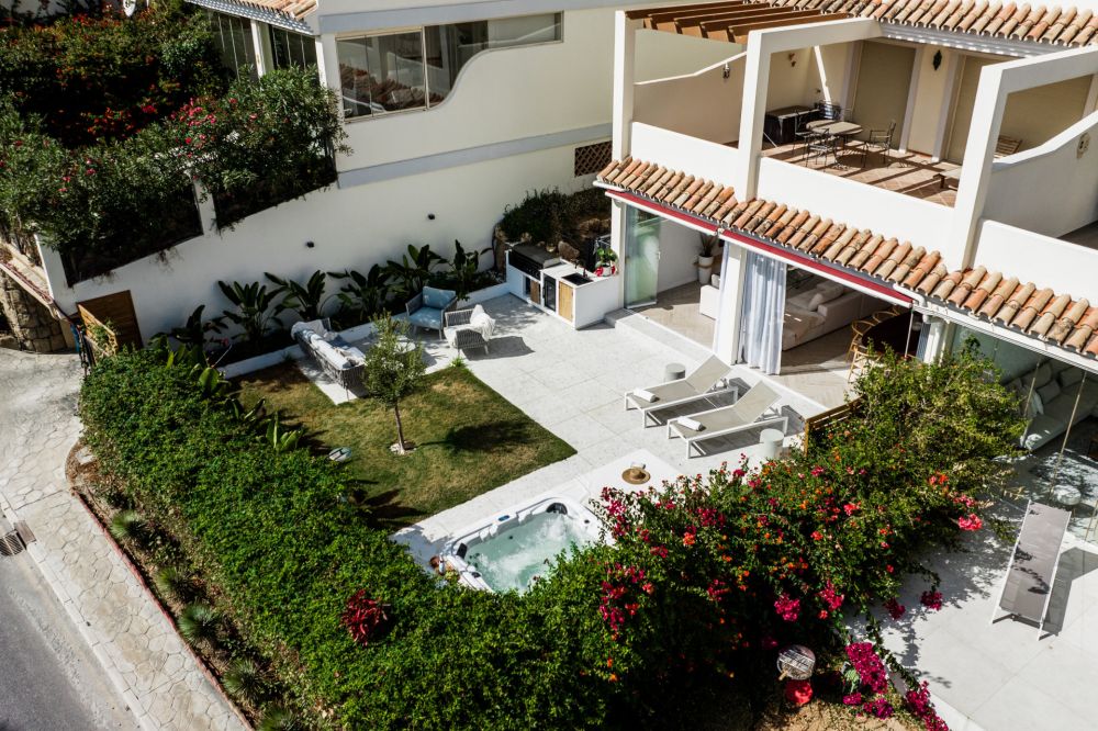 Renovated luxury apartment with scenic garden views.