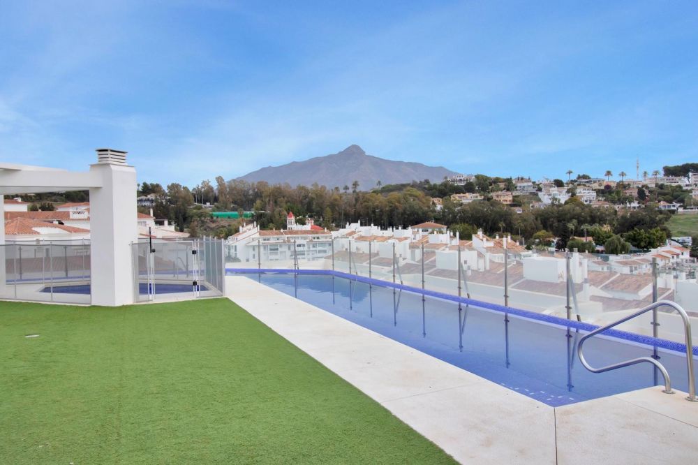 Modern apartment with pool, garden, and security.