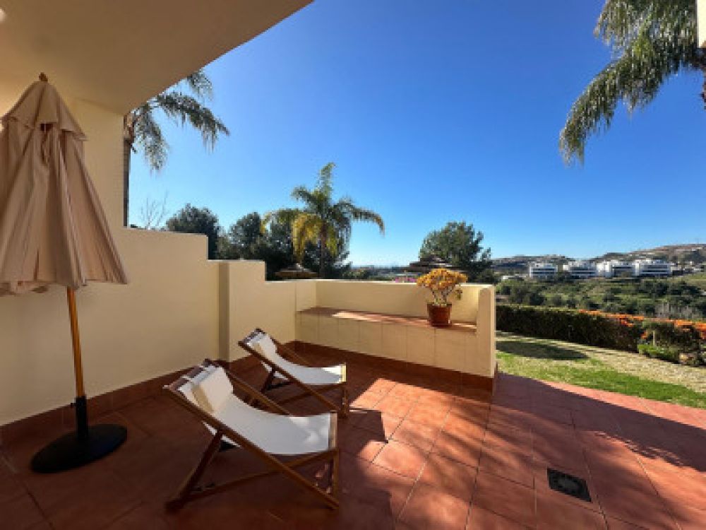 Luxurious ground-floor apartment with garden and views.